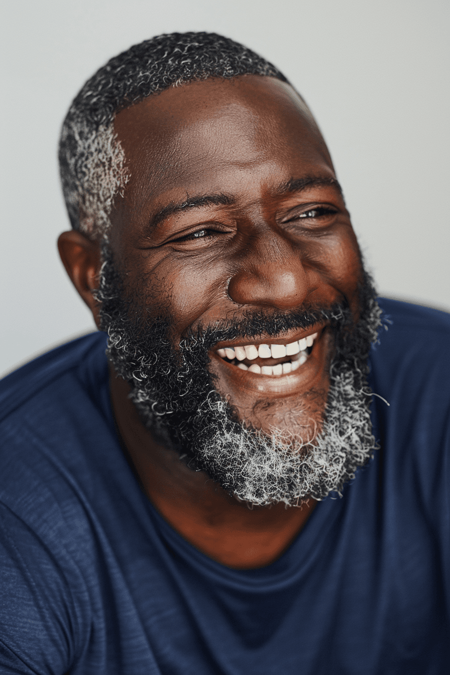 Smiling older man in a beige shirt